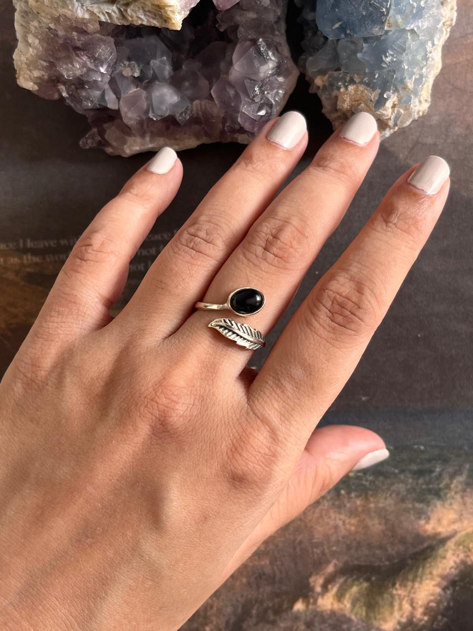 Stylish black onyx and feather design adjustable silver ring for a bold statement.