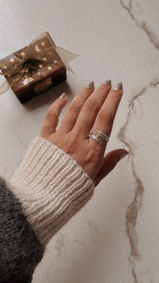 Timeless feather wrap silver ring featuring a delicate, adjustable band