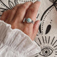 Close-up of cherry blossom silver ring with Larimar gemstone