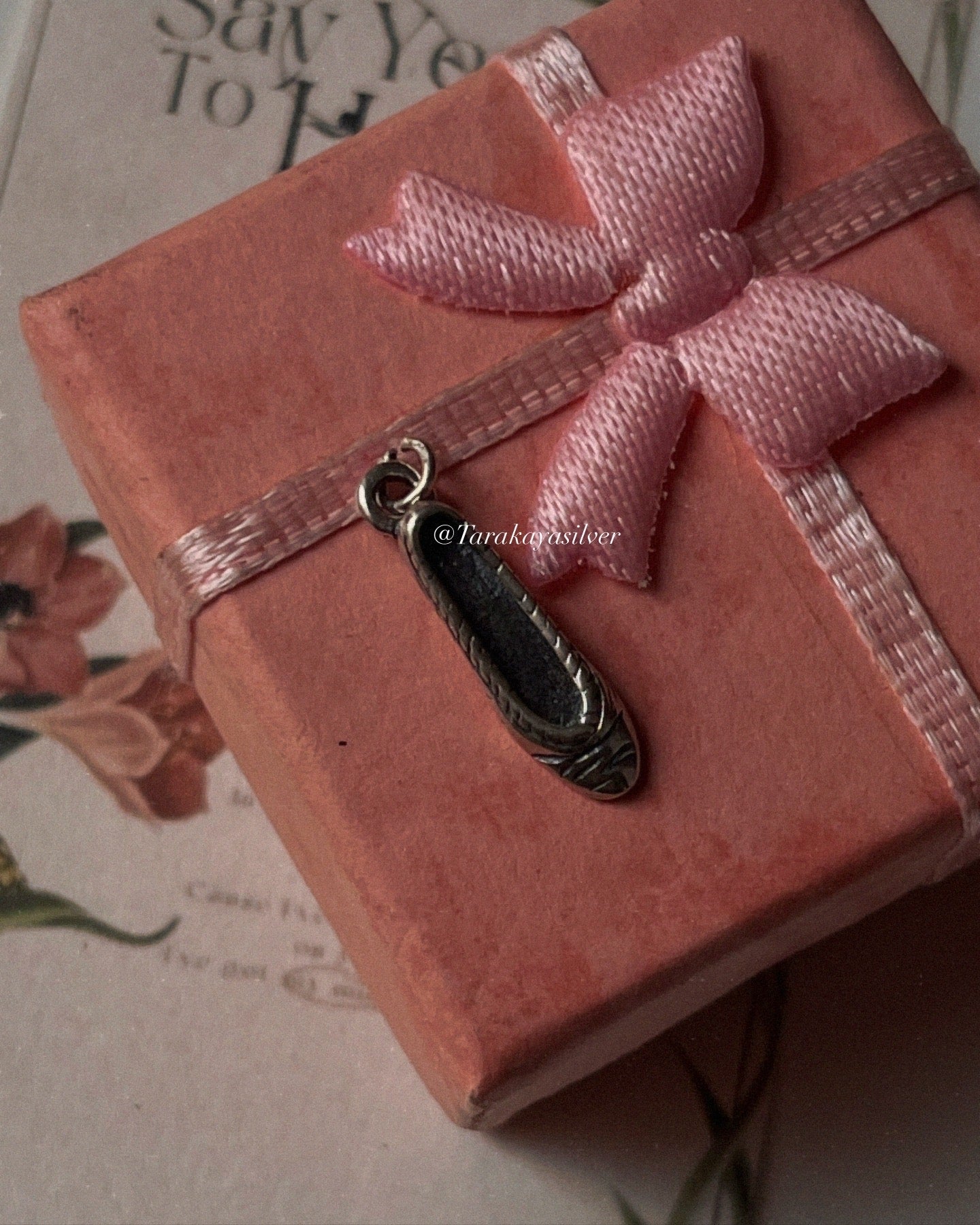 Sterling silver charm in the shape of princess shoes