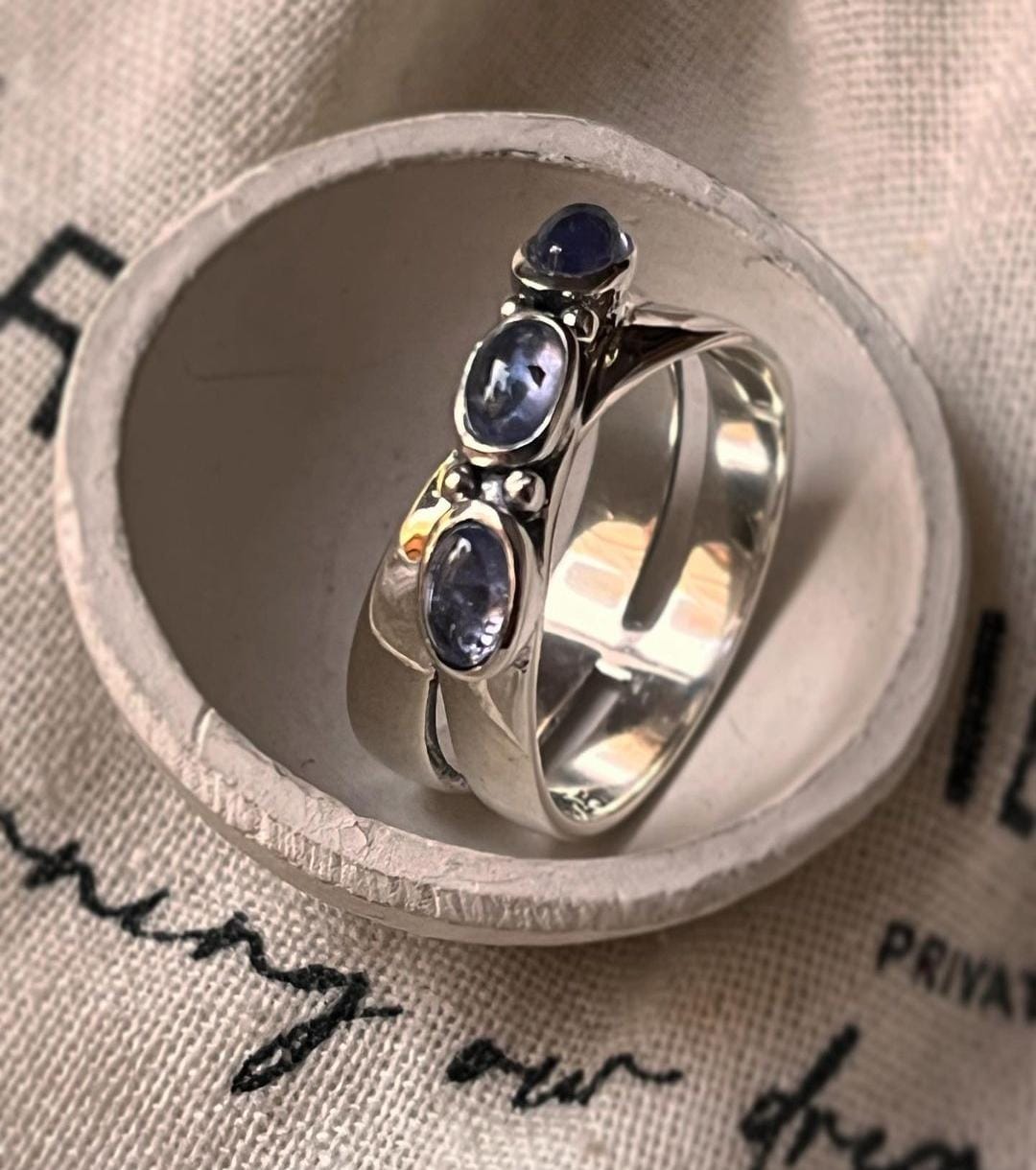 Trendy tanzanite cross silver band ring