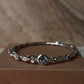 Artisan 925 sterling silver bangle with blue topaz forest design