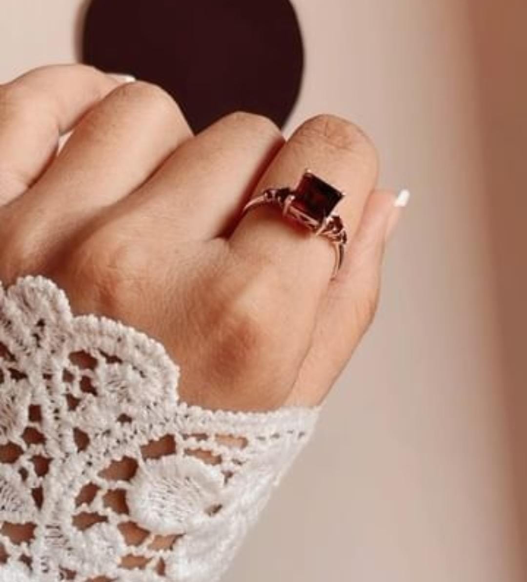 Vintage silver ring with intricate details and square-cut garnet