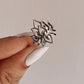 Bold big lotus silver ring with intricate floral design.