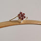 Garnet gemstone flower ring with a striking silver band