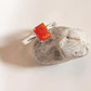 Modern carnelian rectangular stone mounted on a silver ring band