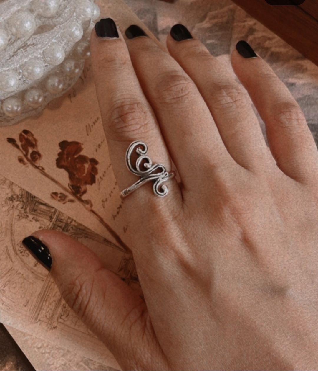 Handcrafted silver ring with spiral detailing