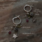 Italian silver hoop earrings with butterfly, flower, and gemstone charms  