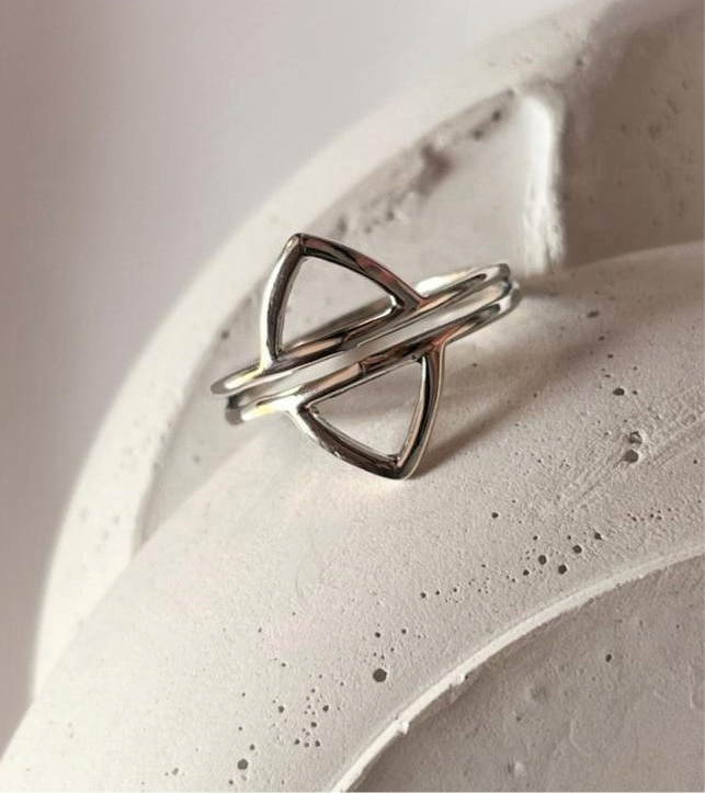 Timeless silver ring featuring dual design elements for a bold look