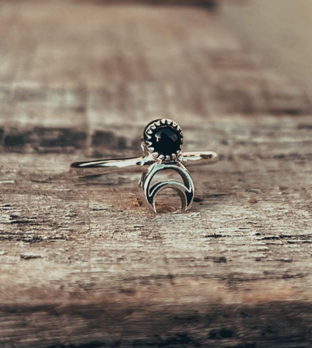 Timeless black onyx crescent moon ring in sterling silver.