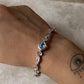 Handcrafted sterling silver bangle with blue topaz gemstone