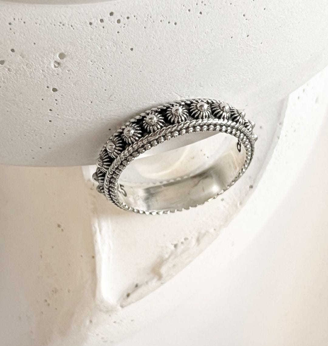 Elegant Balinese fixed size silver ring with intricate design.