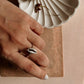 Chic cowrie seashell design set in a fine silver ring