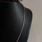 Polished silver snake chain necklace with a smooth, shiny finish