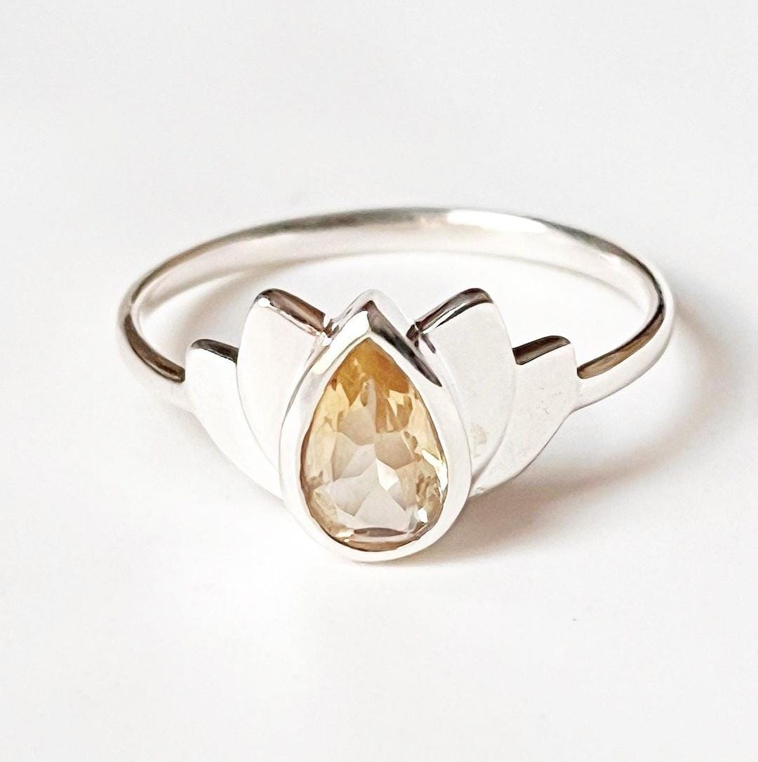 Stylish citrine divine lotus ring in sterling silver with floral detailing