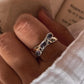 Handcrafted tanzanite cross band ring in sterling silver