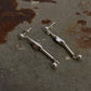 925 Sterling Silver Handcrafted Tribal Contemporary Mandali Earrings displayed on a rustic surface.