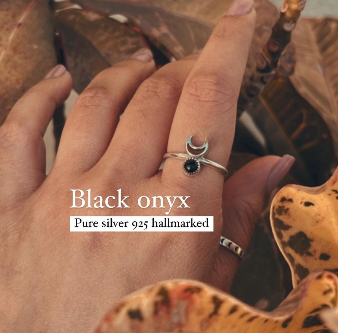 Elegant black onyx crescent moon silver ring with intricate design.