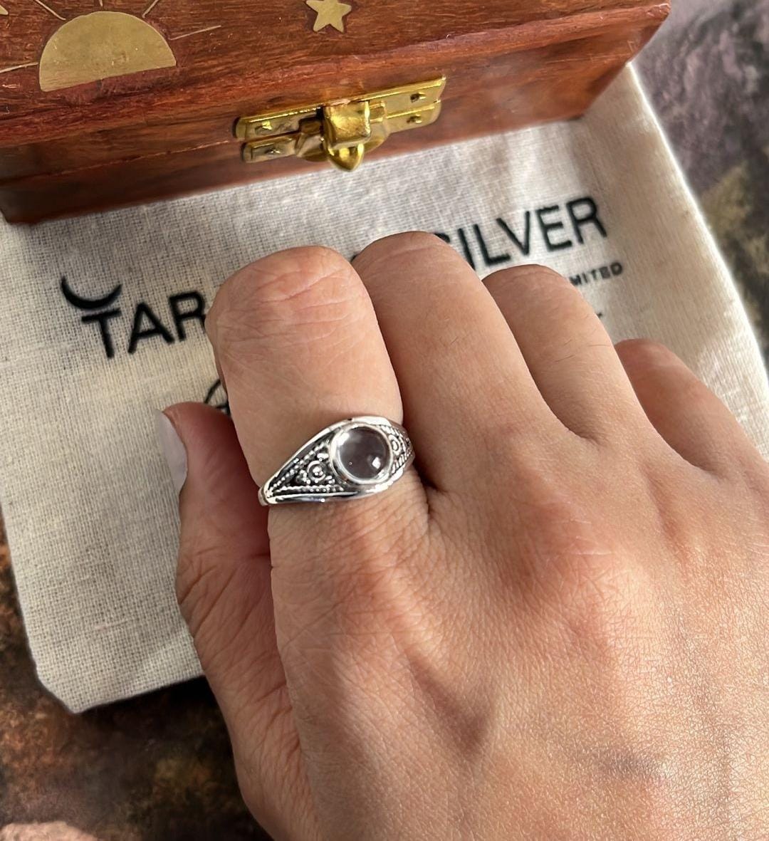 Elegant clear quartz round stone set in a boho-style silver ring