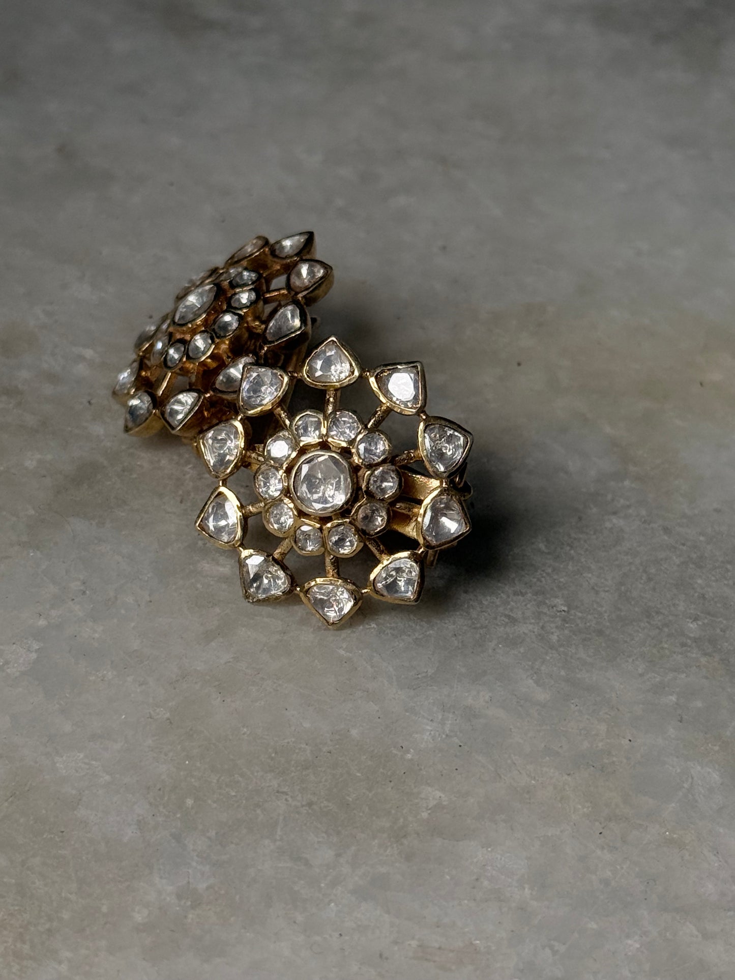 925 Sterling Silver Gold Plated Antique Moissanite Polki Earrings showcasing intricate floral design with sparkling stones.