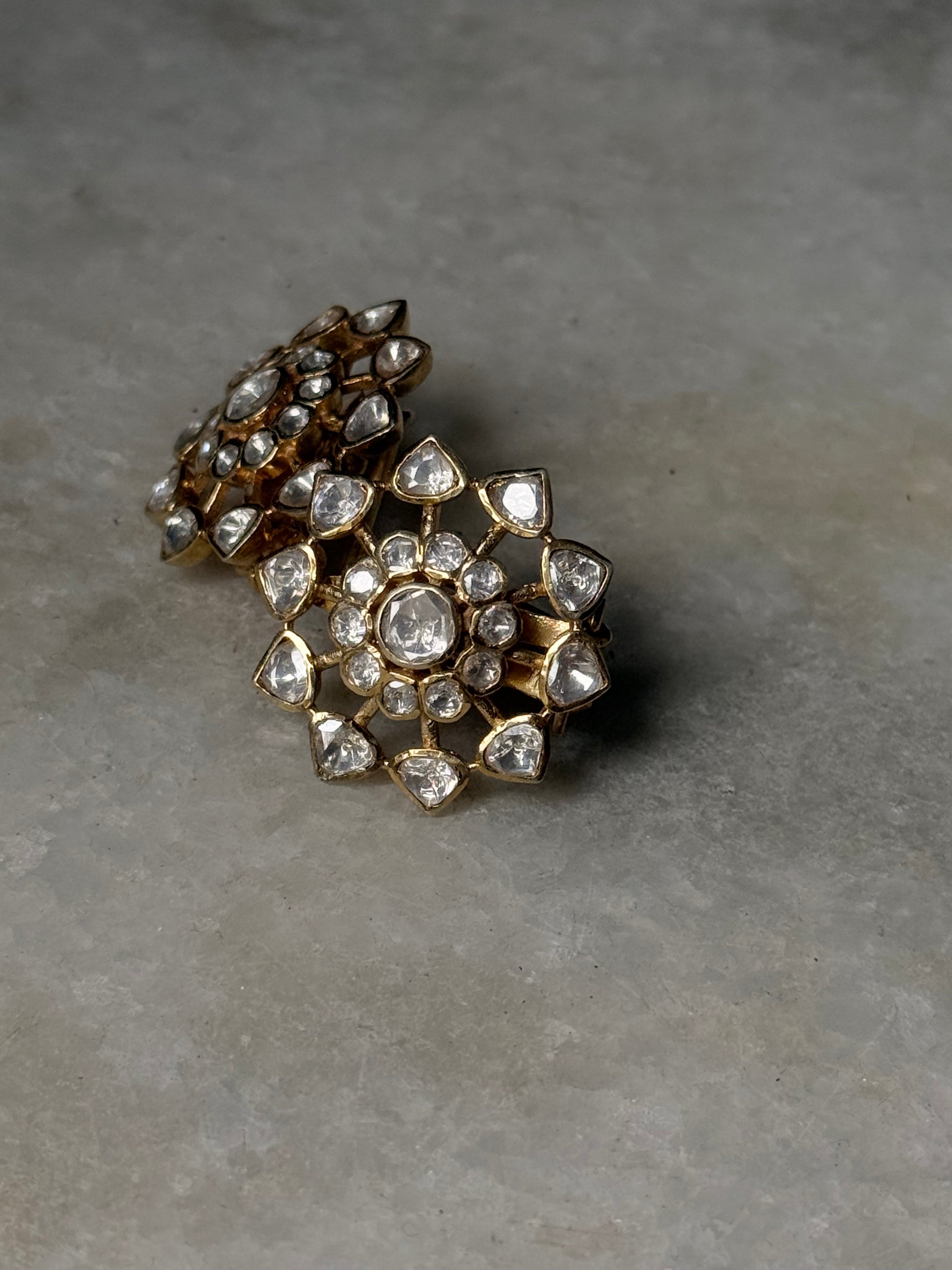 925 Sterling Silver Gold Plated Antique Moissanite Polki Earrings showcasing intricate floral design with sparkling stones.
