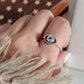 Stylish evil eye silver ring with blue topaz and boho detailing