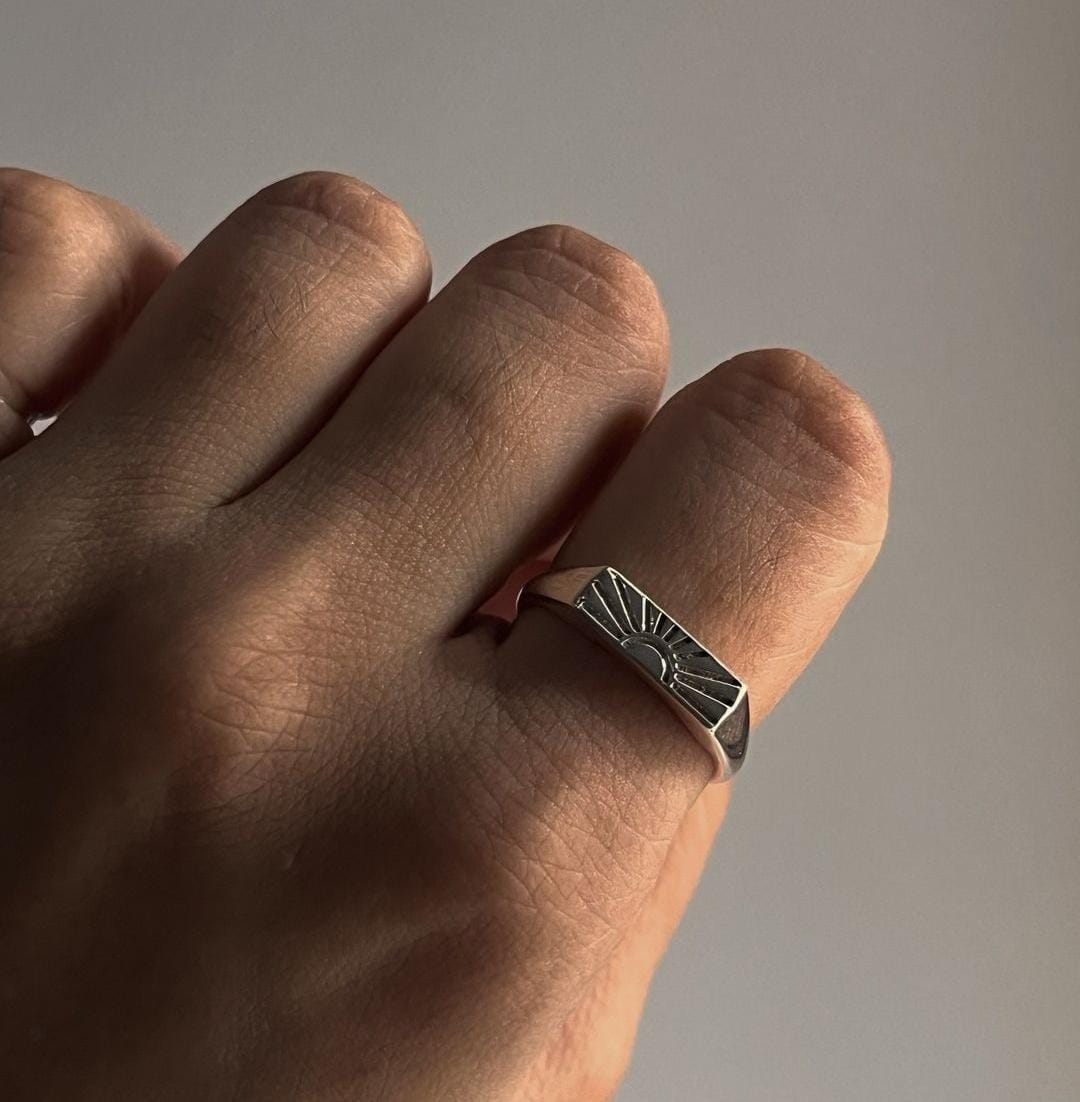 Delicate sun engraved signet ring for a bold look