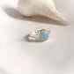 Timeless sterling silver ring featuring a natural oval aquamarine gemstone.