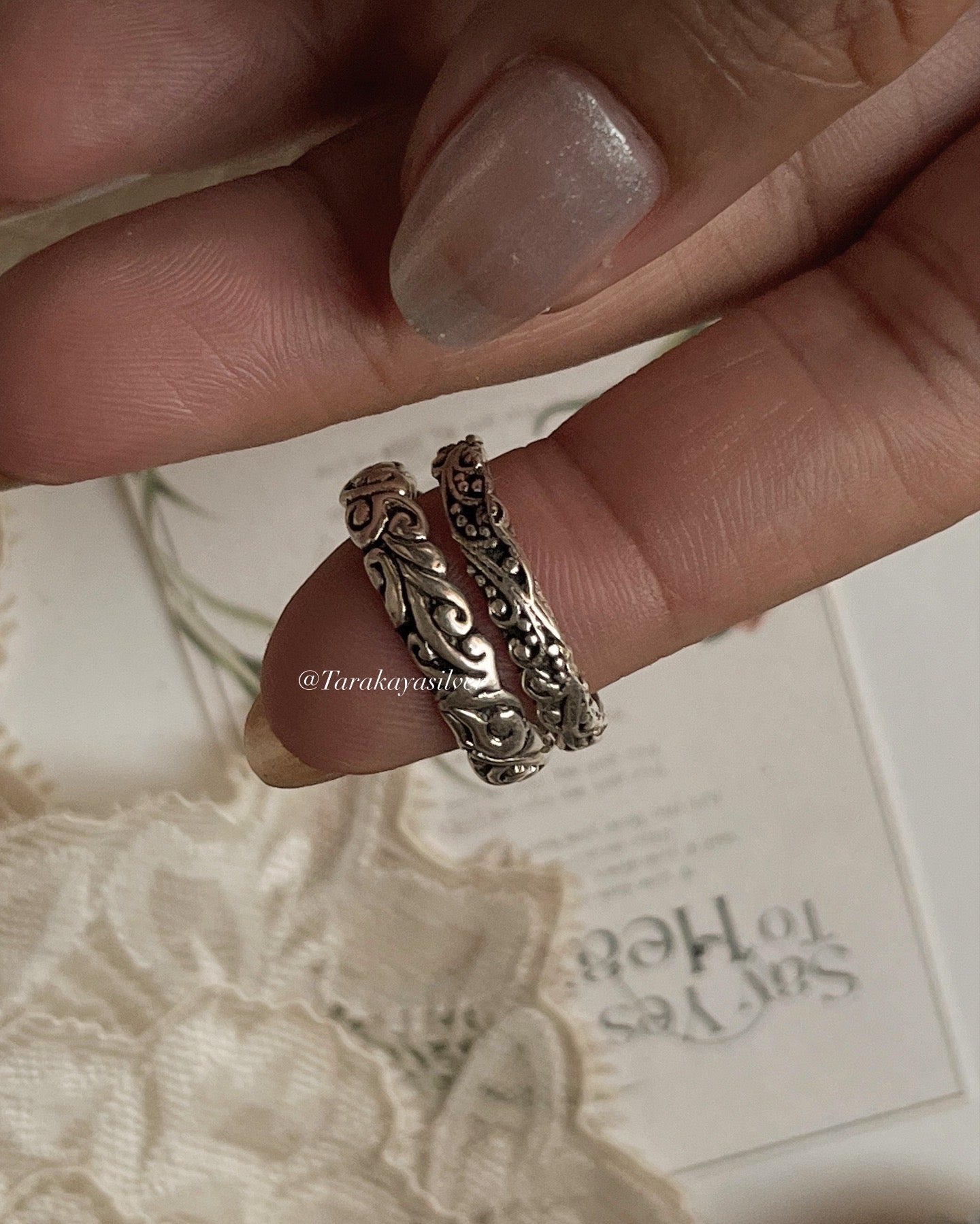 Handcrafted silver stack rings with vintage motif design  