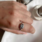 Elegant evil eye boho silver ring featuring a stunning blue topaz