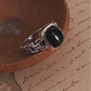 Bold black onyx Cuban link band silver ring with modern design.