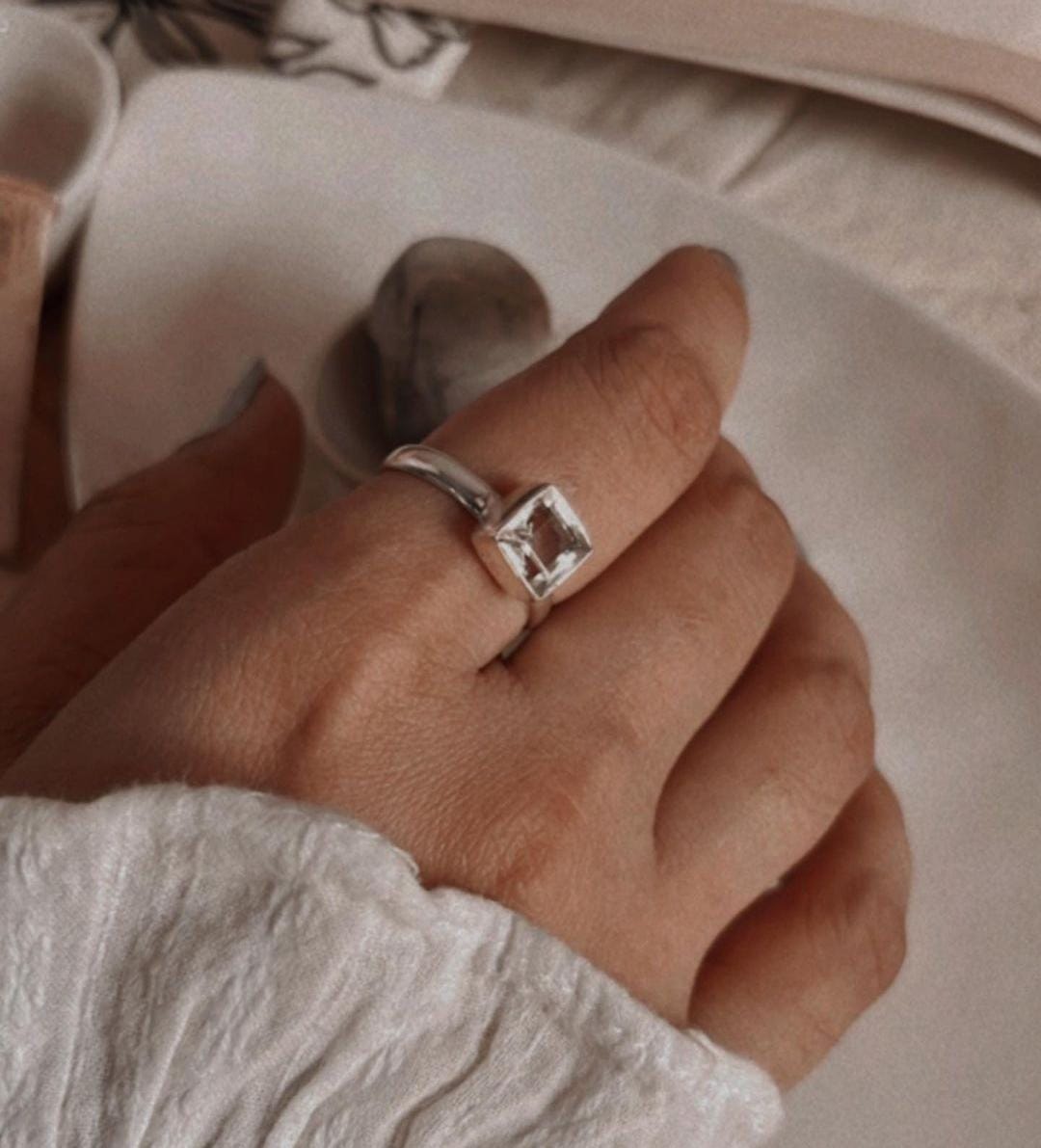 Clear quartz square cut silver ring with sleek, modern design