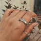 Close-up of double design silver band unisex ring with modern appeal
