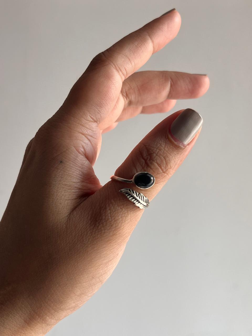 Charming black onyx and feather adjustable silver ring for a unique look.
