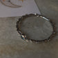 Artisan 925 sterling silver bangle with blue topaz forest design