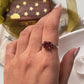Antique-style silver ring with a square-cut garnet gemstone