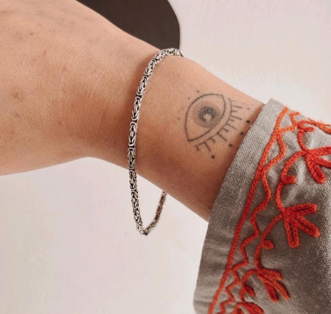 Antique Silver Bracelet with Detailed Pattern Design