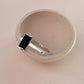 Chic Silver Ring Featuring Black Onyx and Side Stones