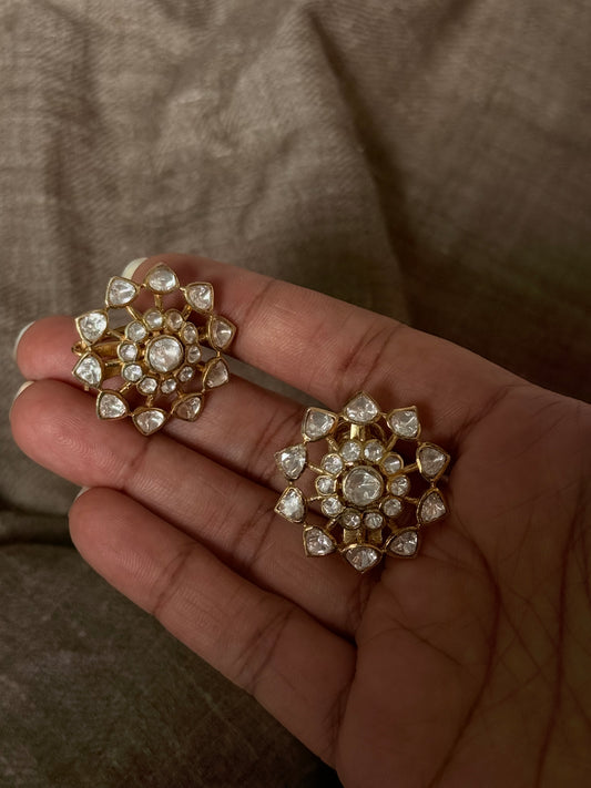 925 Sterling Silver Gold Plated Antique Moissanite Polki Earrings in hand, showcasing floral design and elegance.