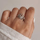 Elegant silver ring with a large, intricate lotus flower design.
