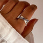 Charming tanzanite gemstone cross band ring in silver