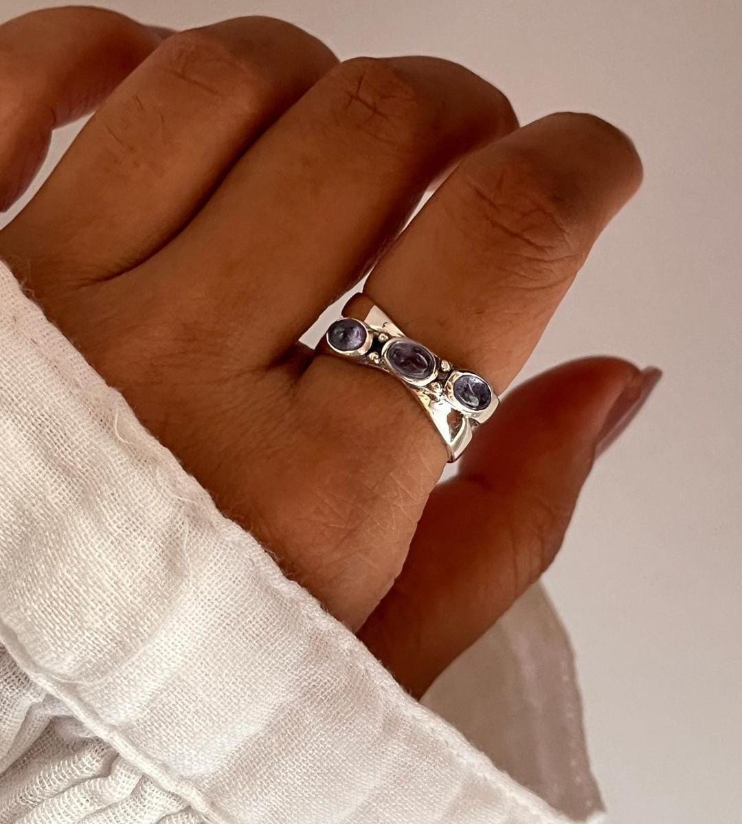 Charming tanzanite gemstone cross band ring in silver