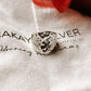 Chunky hammered silver ring with a contemporary design