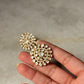 Hand holding 925 Sterling Silver Gold Plated Antique Moissanite Polki Earrings with intricate design.