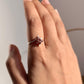Elegant garnet flower statement ring with intricate silver details