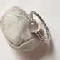 Handcrafted silver ring featuring rose quartz and rope band