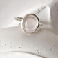 Polished rose quartz oval ring with plain silver band