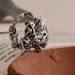 Close-up of fairy in forest silver ring with detailed forest elements