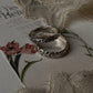 Silver stacking rings with intricate vintage motifs for a classic look  