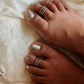 Handmade tribal wavy Rawa pure silver toe ring with intricate detailing.